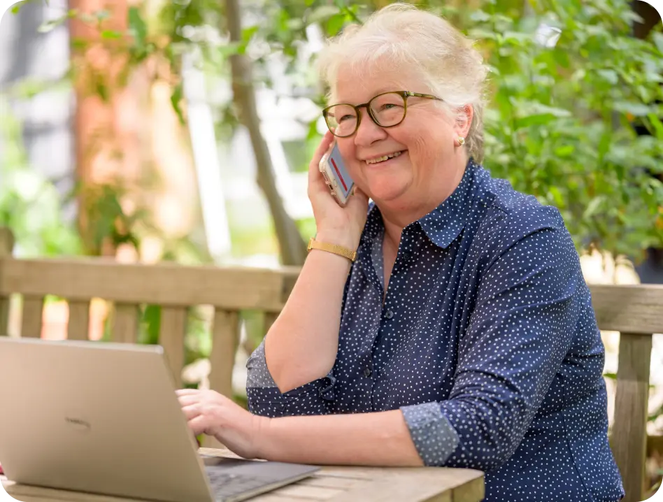 Happy Senior Woman Enjoying Outdoor Tech Time