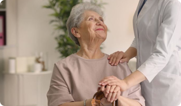 Elderly Woman Smiling with Nurse's Support